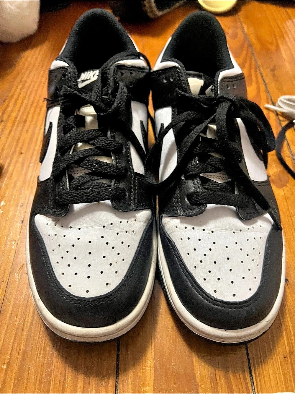 Nike Dunk Low Retro White Black Panda Sneakers in Black & White